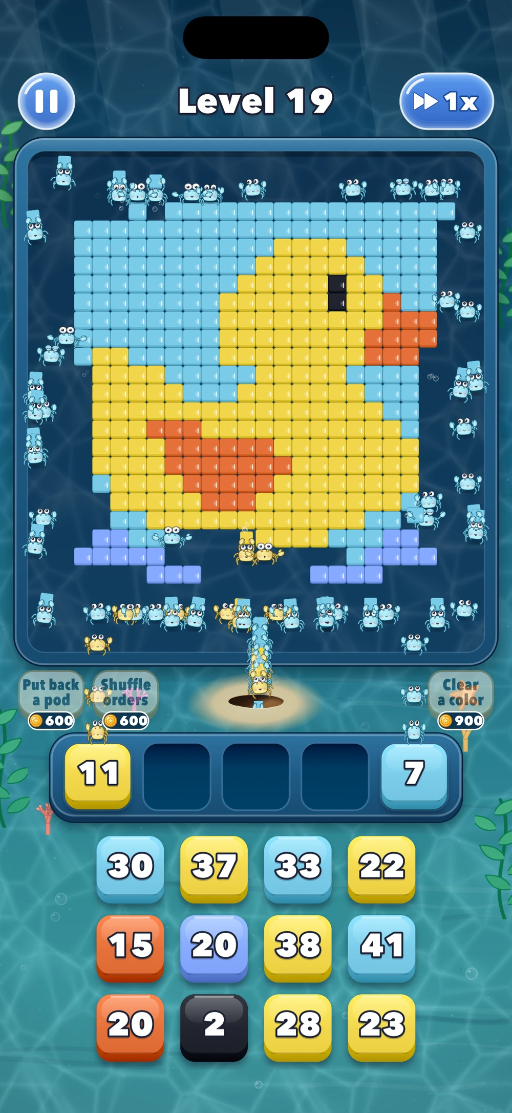 A yellow rubber duck made of blocks while crabs fetch the yellow blocks they can reach